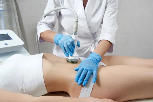 Lost the Weight but Not the Loose Skin? 2 woman having HIFU treatment on her stomach to combat loose skin Royal Tunbridge Wells following weight loss